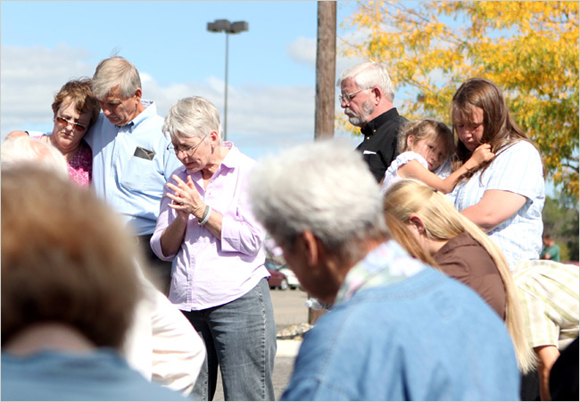 Mourners at Jim Pouillon's Vigil Praying